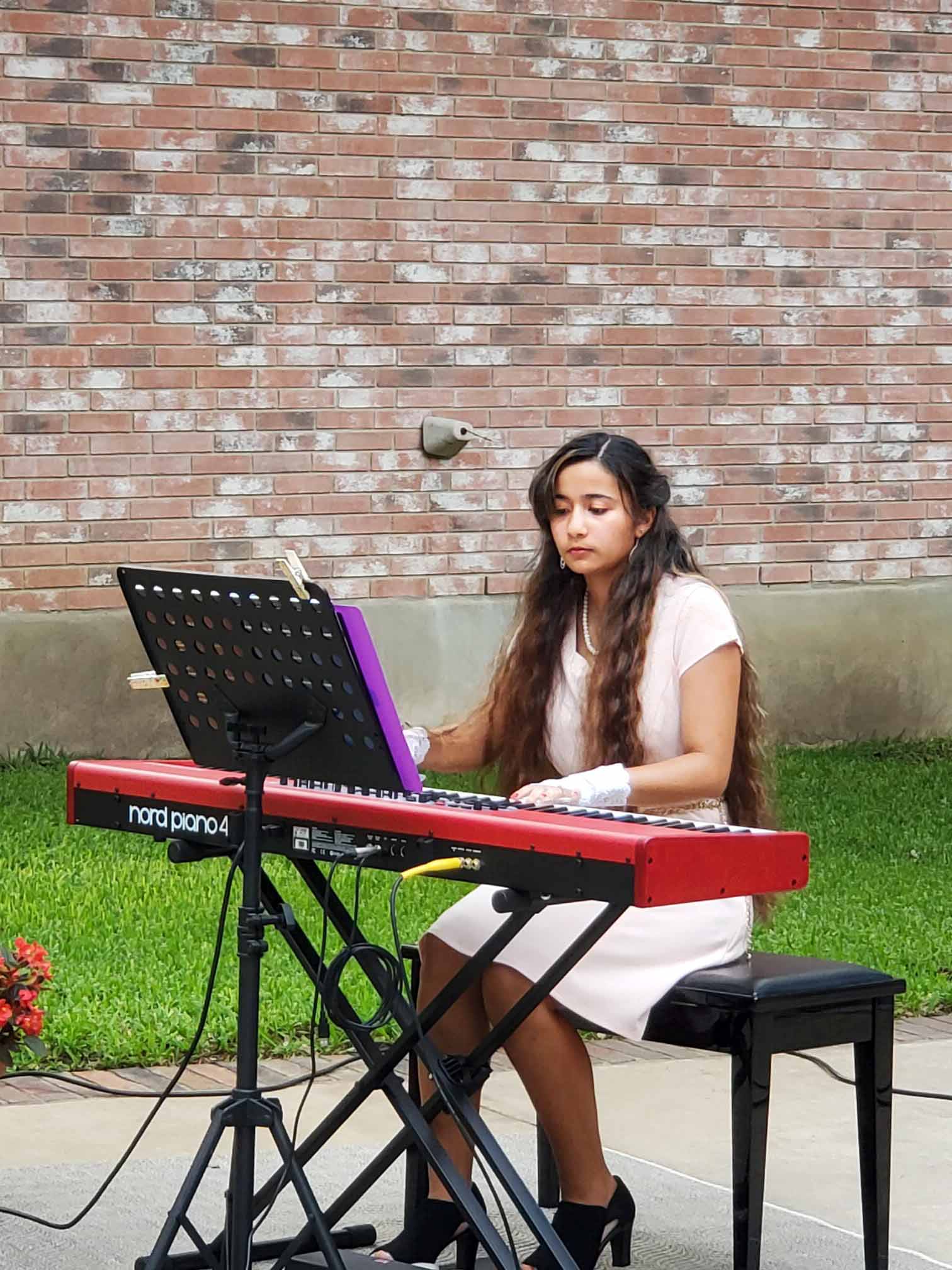 Sherri Stricker student playing piano